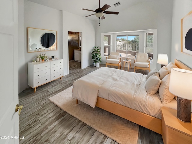 bedroom with vaulted ceiling, ceiling fan, and hardwood / wood-style flooring