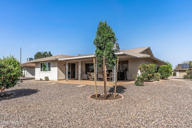 rear view of property featuring a patio area