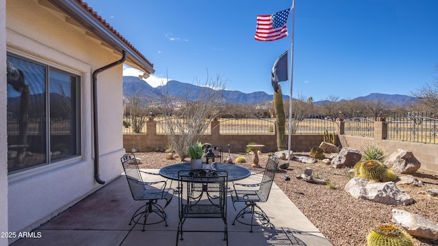 view of patio / terrace featuring a mountain view