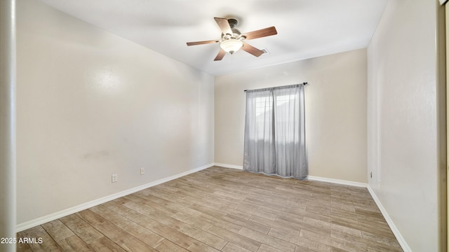 empty room with ceiling fan and light wood-type flooring