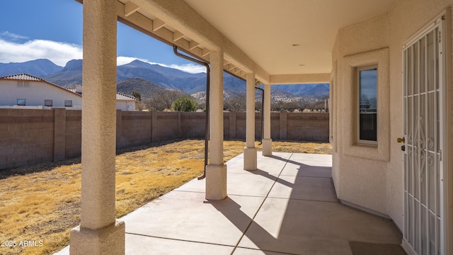 view of patio / terrace featuring a mountain view