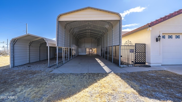 exterior space with a carport and a garage