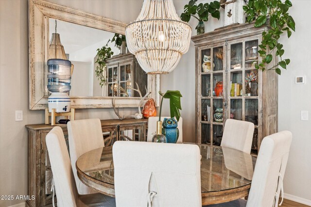 4215 E Ronald St, Gilbert, AZ 85295 - dining room featuring a chandelier and baseboards