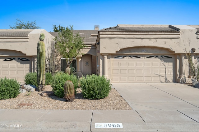 view of front of property featuring a garage