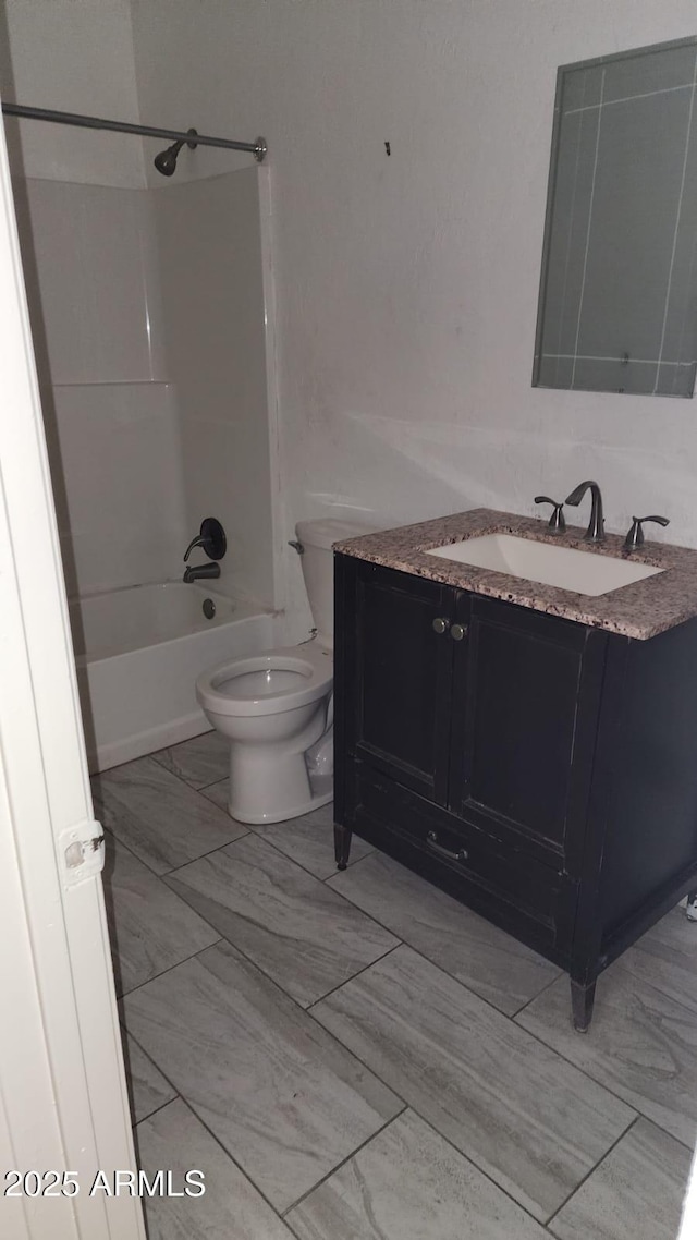 full bathroom with toilet,  shower combination, and vanity