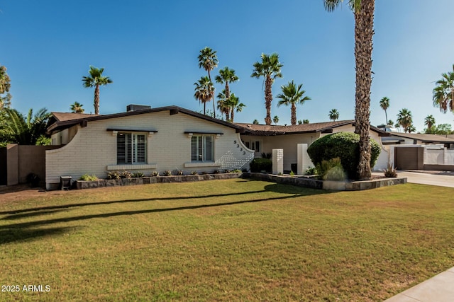 5333 E Sheena Dr, Scottsdale, AZ 85254 - view of front of home with a front lawn, an attached garage, driveway, and brick siding