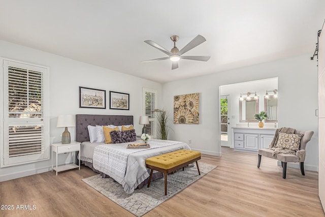 5333 E Sheena Dr, Scottsdale, AZ 85254 - bedroom with light wood-style flooring, baseboards, ensuite bathroom, and a ceiling fan