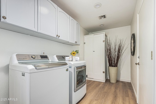 5333 E Sheena Dr, Scottsdale, AZ 85254 - washroom with separate washer and dryer, light wood finished floors, cabinet space, and baseboards
