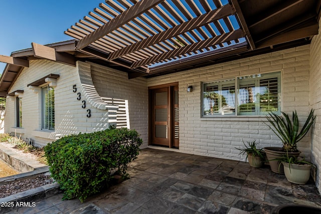5333 E Sheena Dr, Scottsdale, AZ 85254 - entrance to property featuring a patio, brick siding, and a pergola