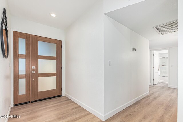 5333 E Sheena Dr, Scottsdale, AZ 85254 - foyer featuring light wood finished floors and baseboards