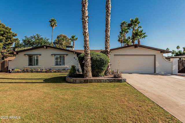 5333 E Sheena Dr, Scottsdale, AZ 85254 - view of front of house featuring concrete driveway, a front yard, and a garage