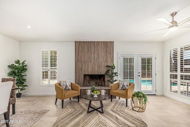 5333 E Sheena Dr, Scottsdale, AZ 85254 - living area featuring french doors, baseboards, ceiling fan, recessed lighting, and a large fireplace