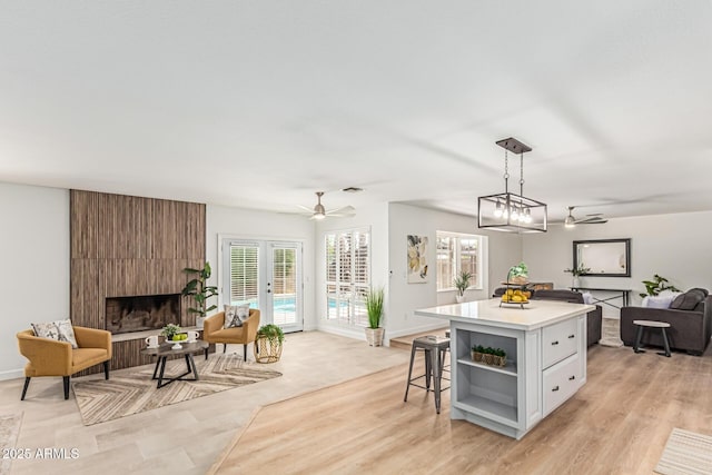 5333 E Sheena Dr, Scottsdale, AZ 85254 - kitchen featuring open floor plan, open shelves, light countertops, ceiling fan, and decorative light fixtures