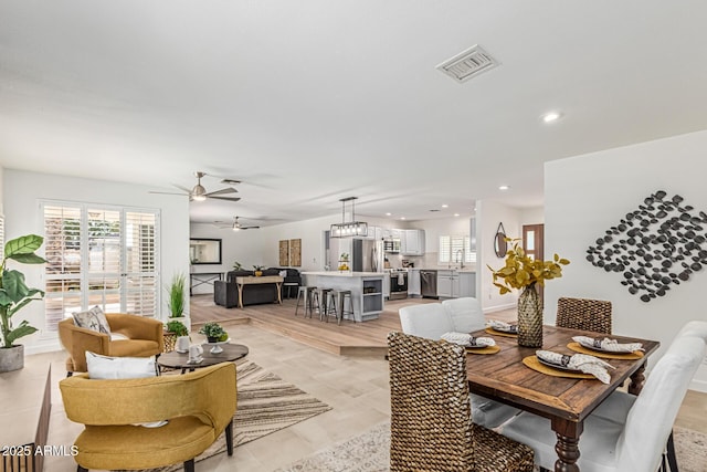 5333 E Sheena Dr, Scottsdale, AZ 85254 - dining area with healthy amount of natural light, a ceiling fan, and recessed lighting