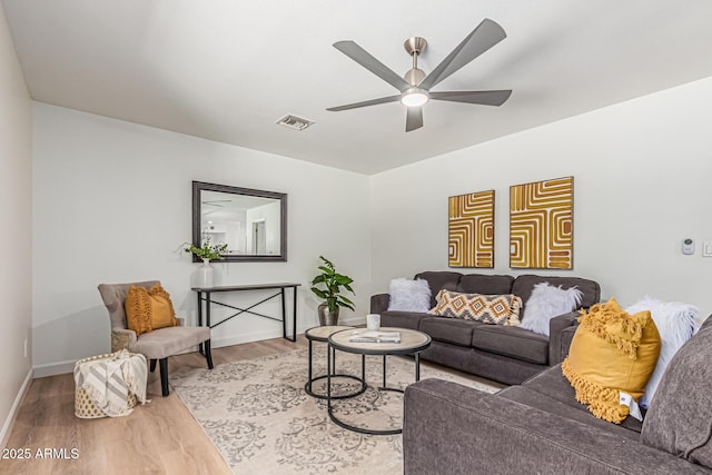 5333 E Sheena Dr, Scottsdale, AZ 85254 - living area featuring a ceiling fan, wood finished floors, and baseboards