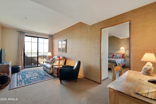 carpeted living room featuring lofted ceiling