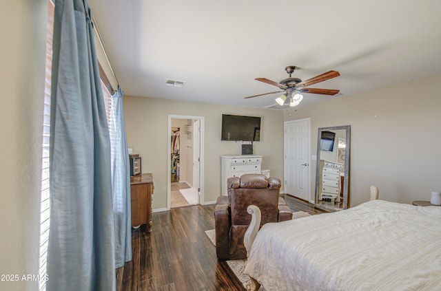 bedroom with ceiling fan, dark wood finished floors, a closet, visible vents, and baseboards