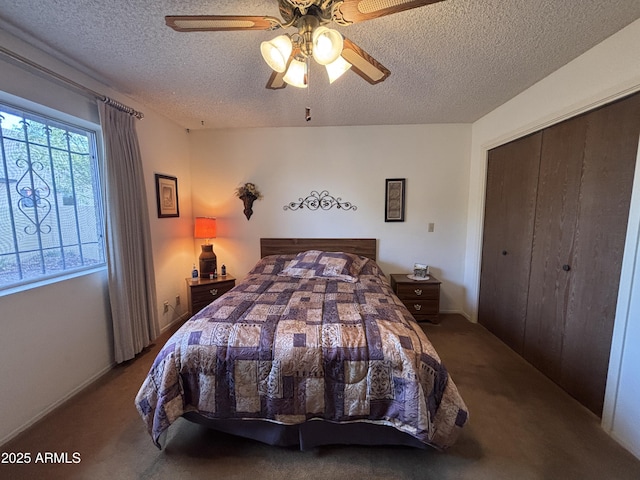 carpeted bedroom featuring ceiling fan, a textured ceiling, and a closet