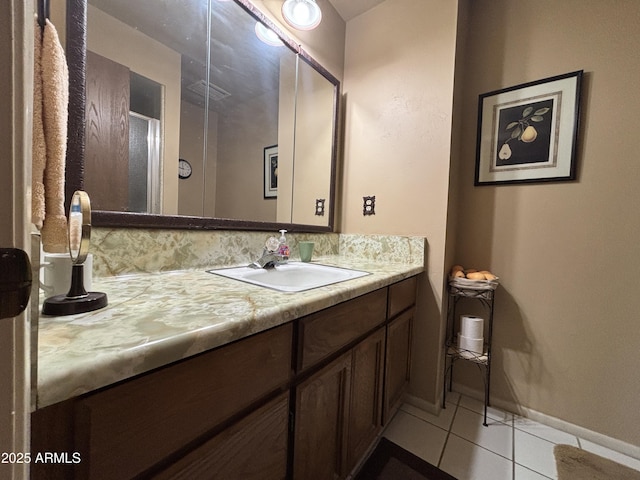 bathroom with tile patterned flooring and vanity