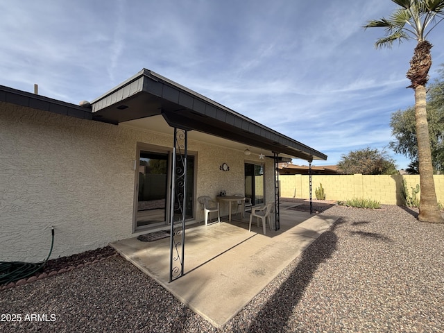 back of property with a patio area