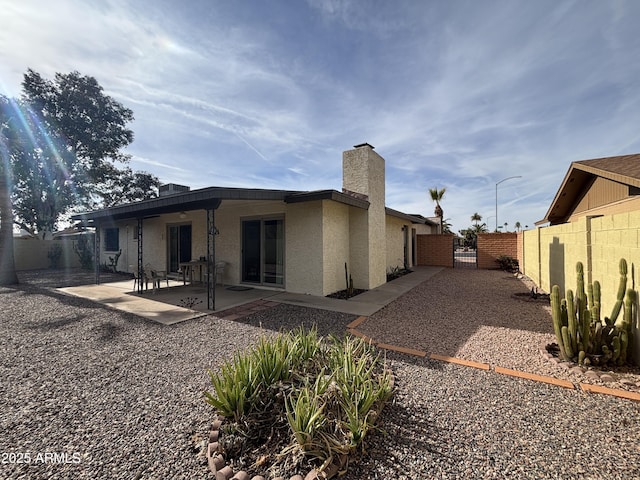 back of property featuring a patio area