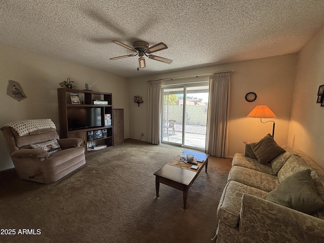 living room featuring carpet, ceiling fan, and a textured ceiling