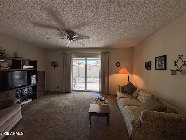 carpeted living room featuring a textured ceiling and ceiling fan