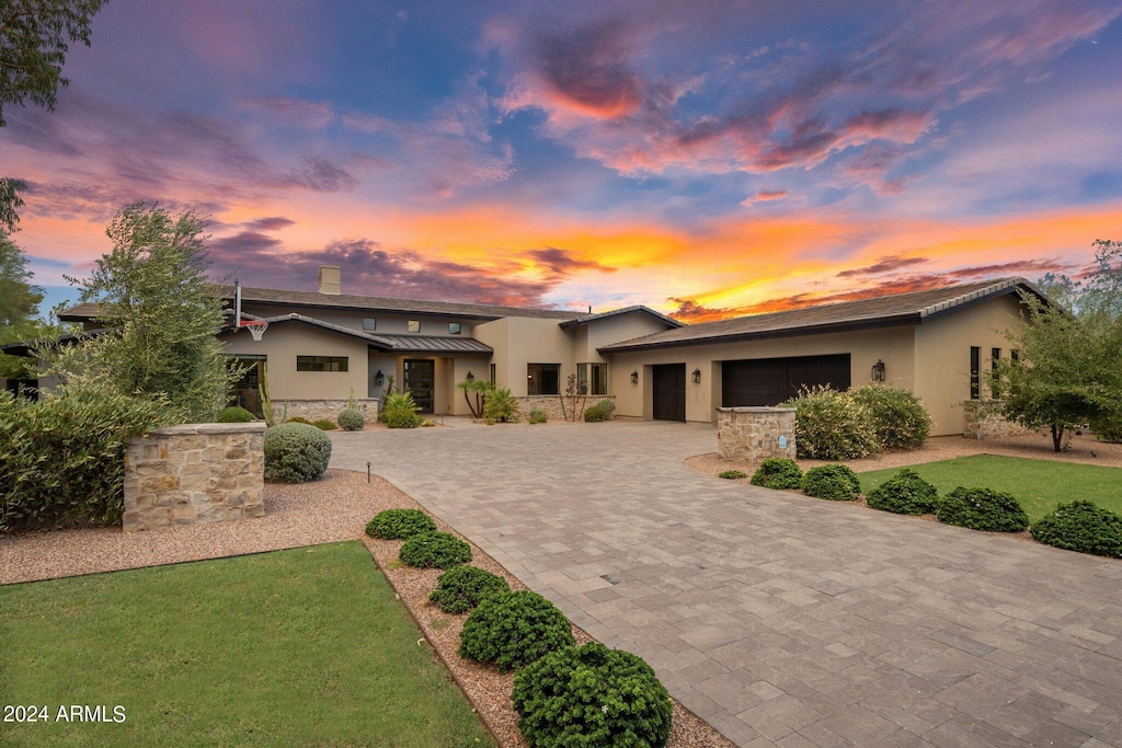 view of front of property with a garage