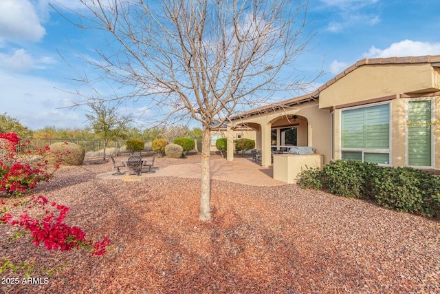 30056 N 129th Ave, Peoria, AZ 85383 - view of yard with a fire pit, a patio, and exterior kitchen