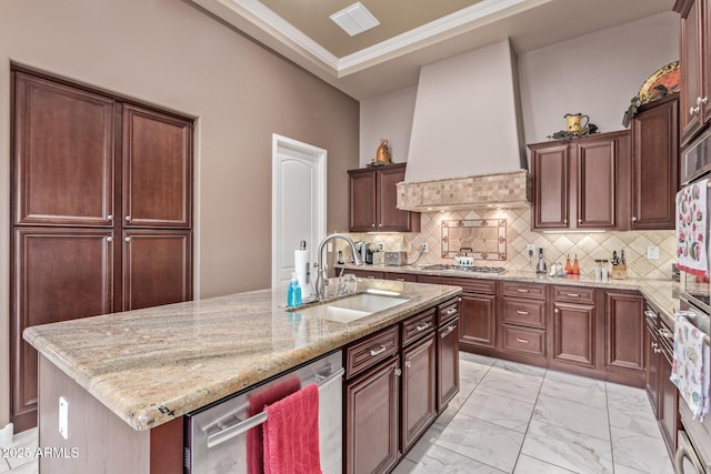 30056 N 129th Ave, Peoria, AZ 85383 - kitchen with premium range hood, sink, light stone counters, appliances with stainless steel finishes, and an island with sink