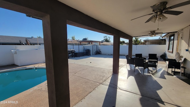 view of patio / terrace with a fenced in pool