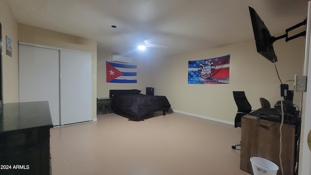 office featuring a wall mounted AC and concrete flooring