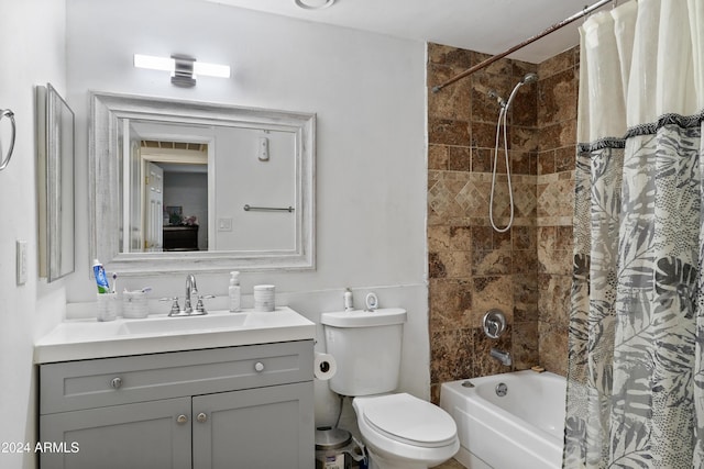 full bathroom featuring vanity, toilet, and shower / tub combo