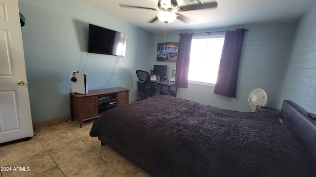 bedroom with ceiling fan and light tile patterned floors