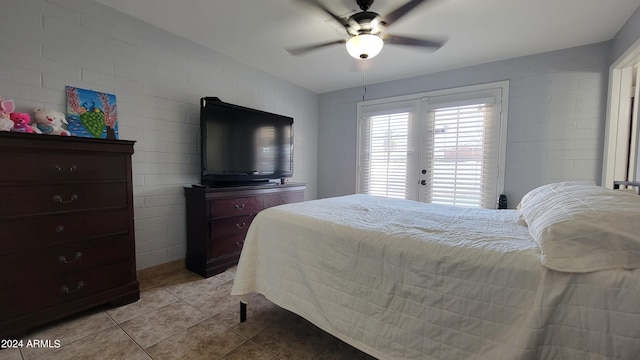 bedroom featuring ceiling fan and light tile patterned flooring