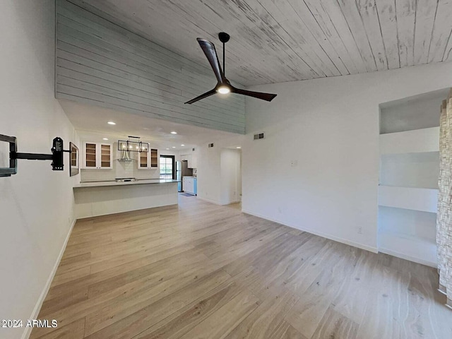 unfurnished living room with high vaulted ceiling, light hardwood / wood-style flooring, and ceiling fan