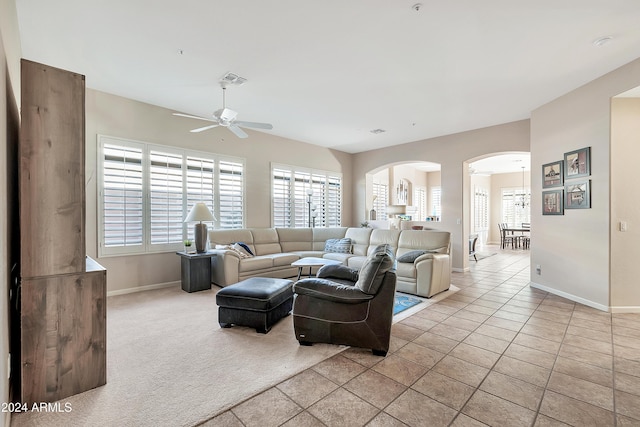 tiled living room featuring ceiling fan