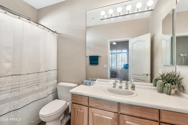 bathroom with toilet and vanity