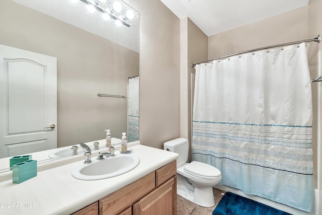 full bathroom featuring toilet, vanity, tile patterned floors, and shower / bathtub combination with curtain