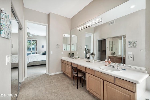 bathroom with ceiling fan, tile patterned floors, and vanity