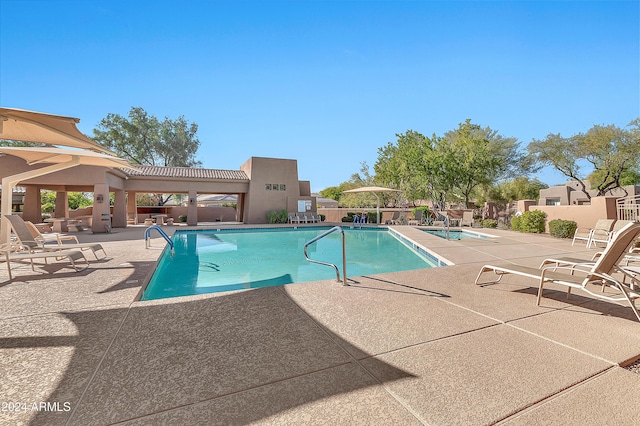 view of swimming pool with a patio area