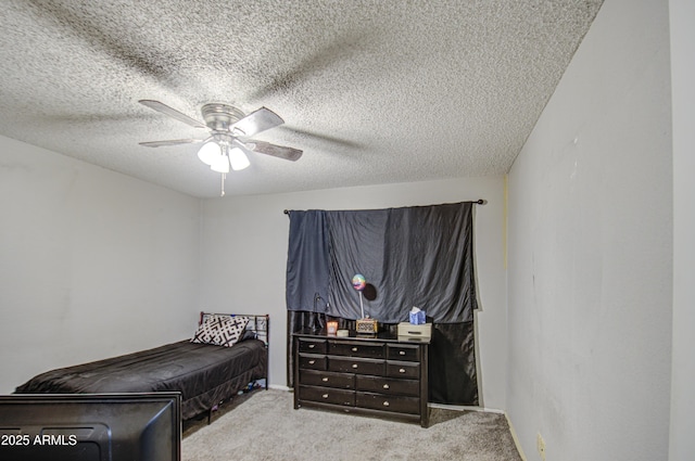 carpeted bedroom with a textured ceiling and ceiling fan