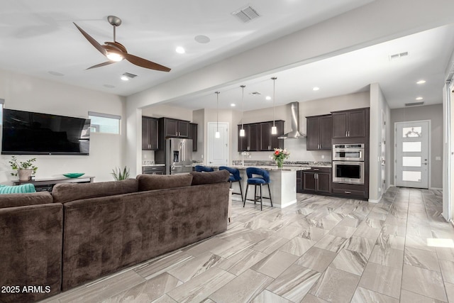 living room featuring ceiling fan