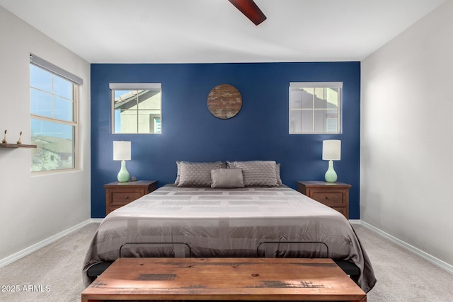 bedroom featuring light colored carpet and ceiling fan