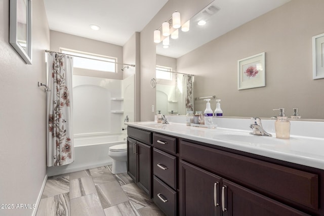 full bathroom with shower / bath combination with curtain, vanity, and toilet