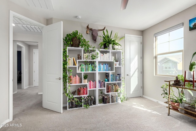 sitting room with light colored carpet