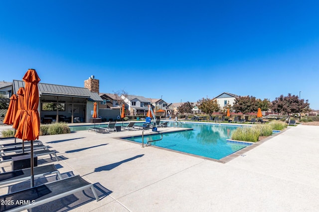 view of swimming pool with a patio area