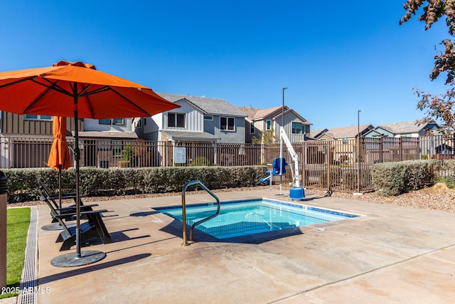 view of swimming pool featuring a patio area