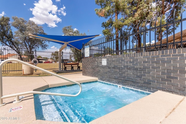 view of pool with fence and a pool
