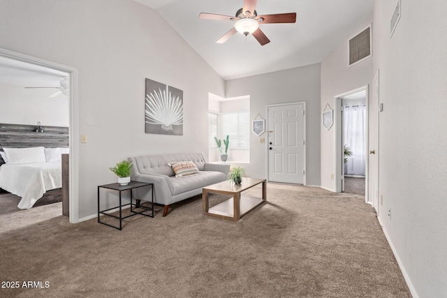 living room featuring visible vents, ceiling fan, and carpet floors